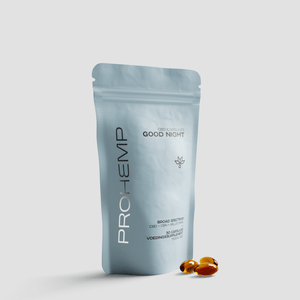 Pouch of broad spectrum CBD capsules Good Night with softgel capsules on white background